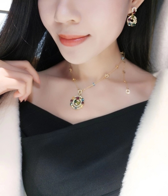 Astrale earrings 18k yellow gold set with blue topaz, green tourmaline, peridot, citrine and red garnet set with diamond